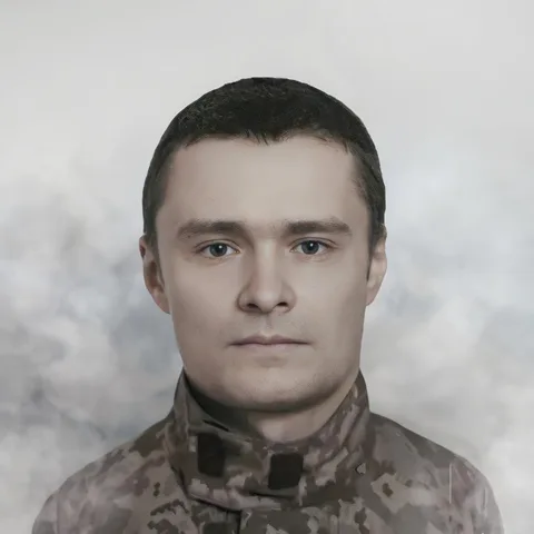 Портрет чоловіка у військовому камуфльованому одязі